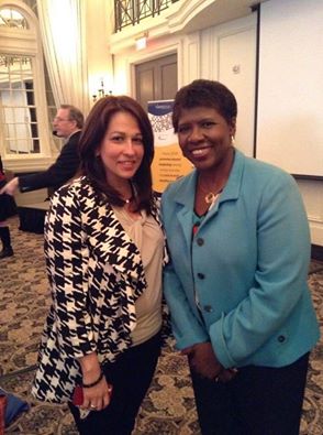 Carol Robles-Román with Gwen Ifill in 2014